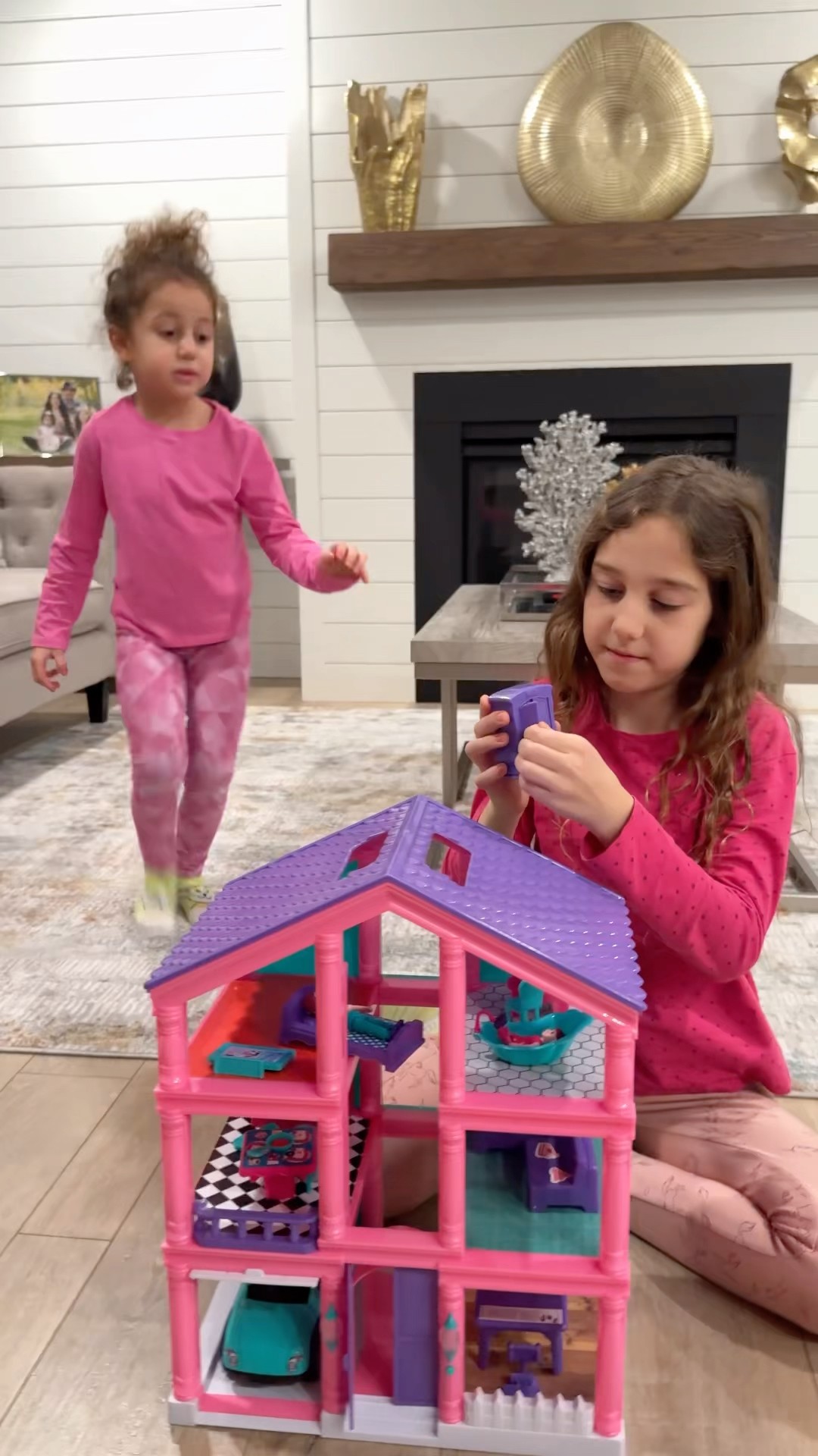 Sierra teaches Rhia to do chores to earn toys