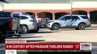 9 in custody after massage parlors raided