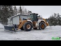 Plows snow with Caterpillar 972M XE Wheel Loader snow removal with diagonal plow Drivex DB 4000mm