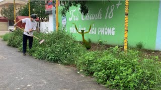 Cleaning up overgrown grass at a sidewalk cafe that has been abandoned for many years