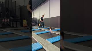 Guy jumps at trampoline park and lands on little girl