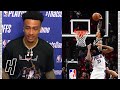 John Collins Pulled Up to His Interview Wearing a Shirt of Him Dunking on Joel Embiid