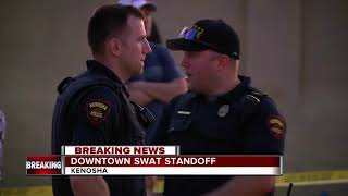 Dozens watch police stand off in Kenosha
