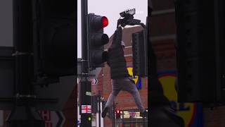 Vandal attacks Ulez camera in broad daylight