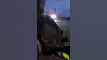 Firefighter Saves Woman From Raging Floodwaters