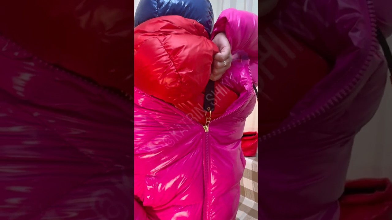 Beautiful Girl in latex and moon boots layering shiny nylon puffy down jackets hoods reversed