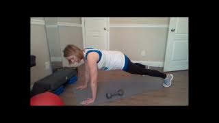Plank with dumbbell pass under