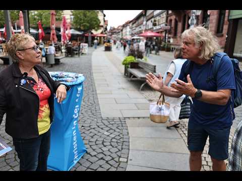 E7 AfD Anne argues with Green environmentalist about climate change: Info booth, Saxony-Anhalt el...