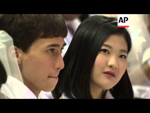 Unification Church holds first mass wedding since death of leader and founder last year