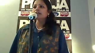 Indian lady singing We Will Rock You