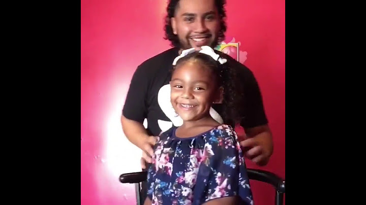 Dad doing daughters hair