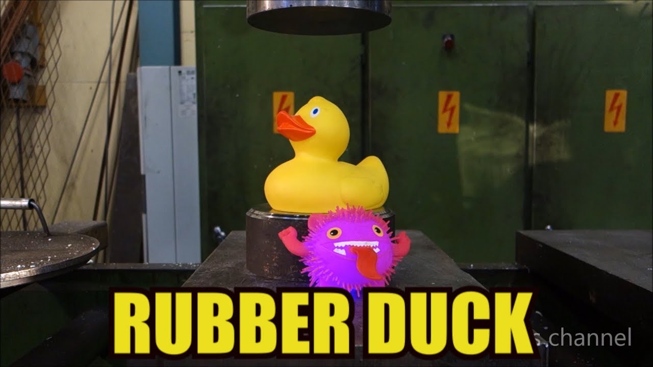 Crushing rubber duck with hydraulic press