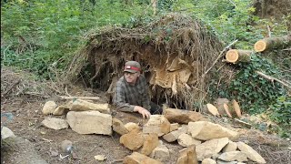 Build a Sloping Shelter in the Middle of the Woods - Rocks galore under a root!