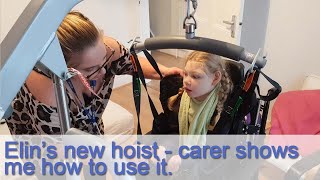 Elin's new hoist  carer shows me how to use it.