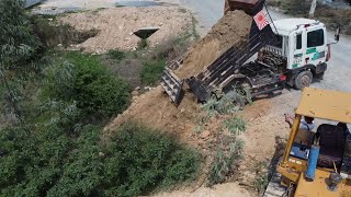 New Project Dozer D37 and Dump Truck projects are running right next to the road.