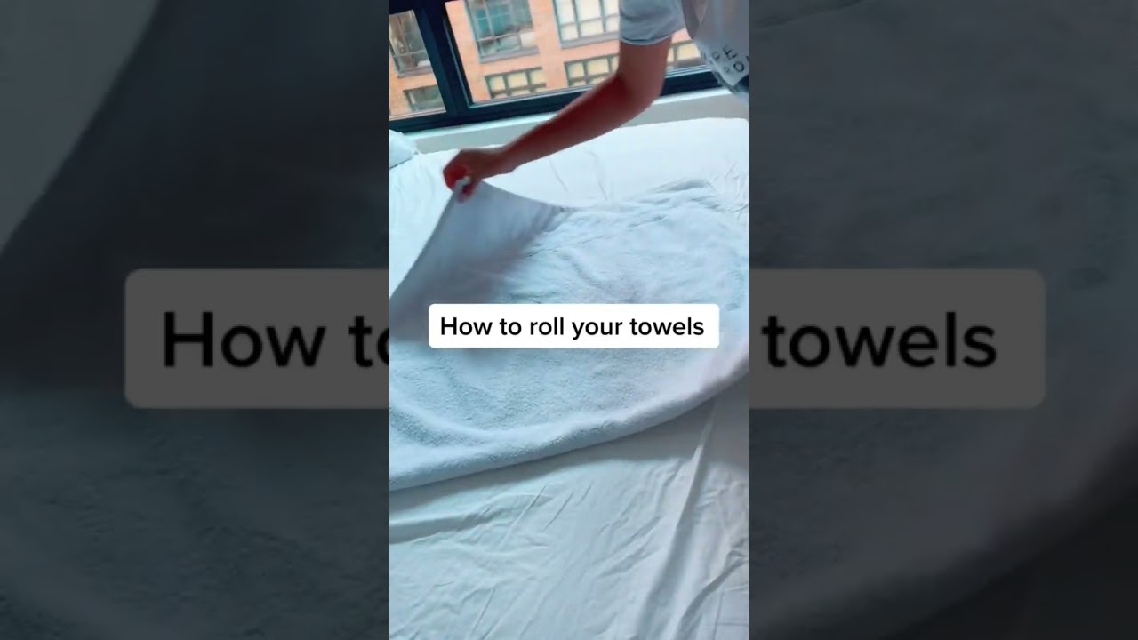 How to roll a towel for packing (step-by-step).