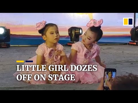 Little girl dozes off during dance performance in China