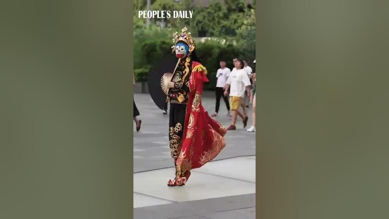 A street artist performs Bian Lian, ace-changing, art