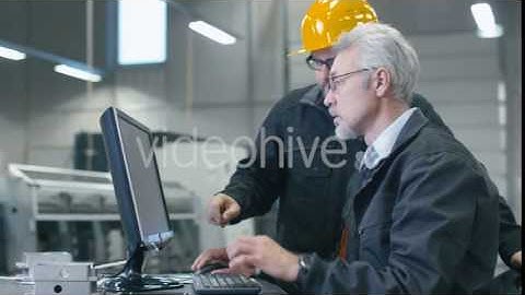 Two Engineers are Working on a Desktop Computer in a Factory - Stock Footage | VideoHive 15142369