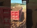 Excavators Load Soil Onto Trucks