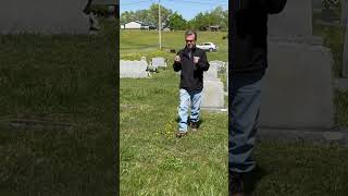 Using dowsing rods to find a grave #