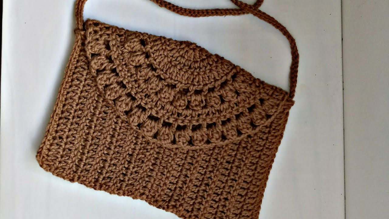Passo a passo completo da bolsa envelope de crochê versátil fácil e econômica de crochê.