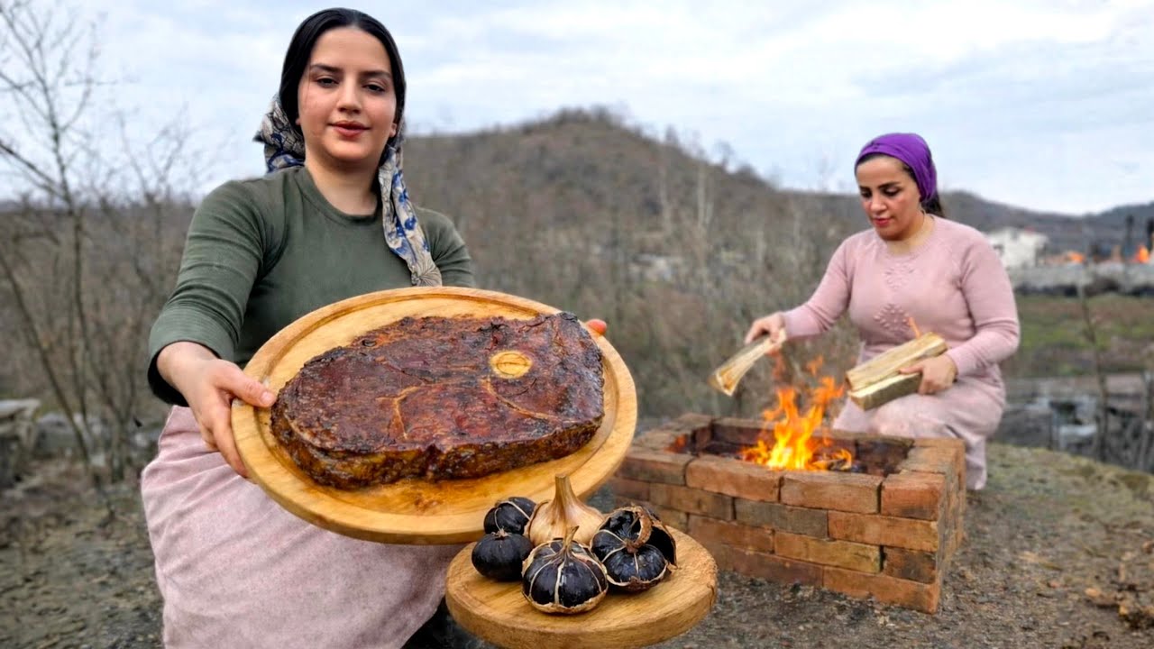 Steak with black garlic cooked over fire