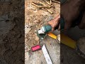 Sharpening an axe with an angle grinder.