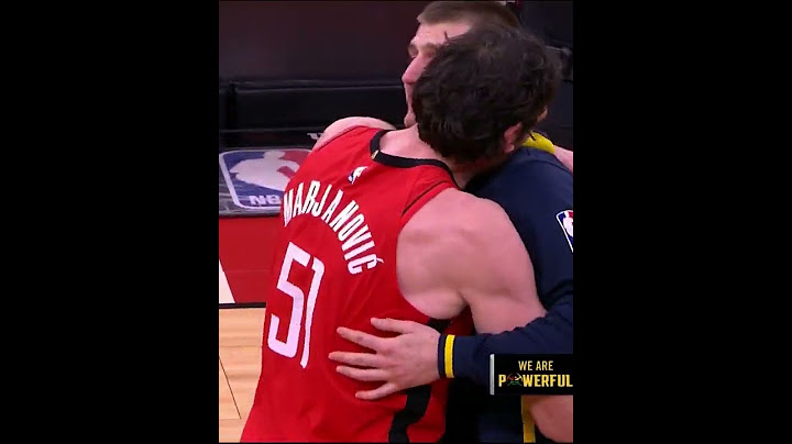 Boban hugs Jokic after recording his 100th career triple-double