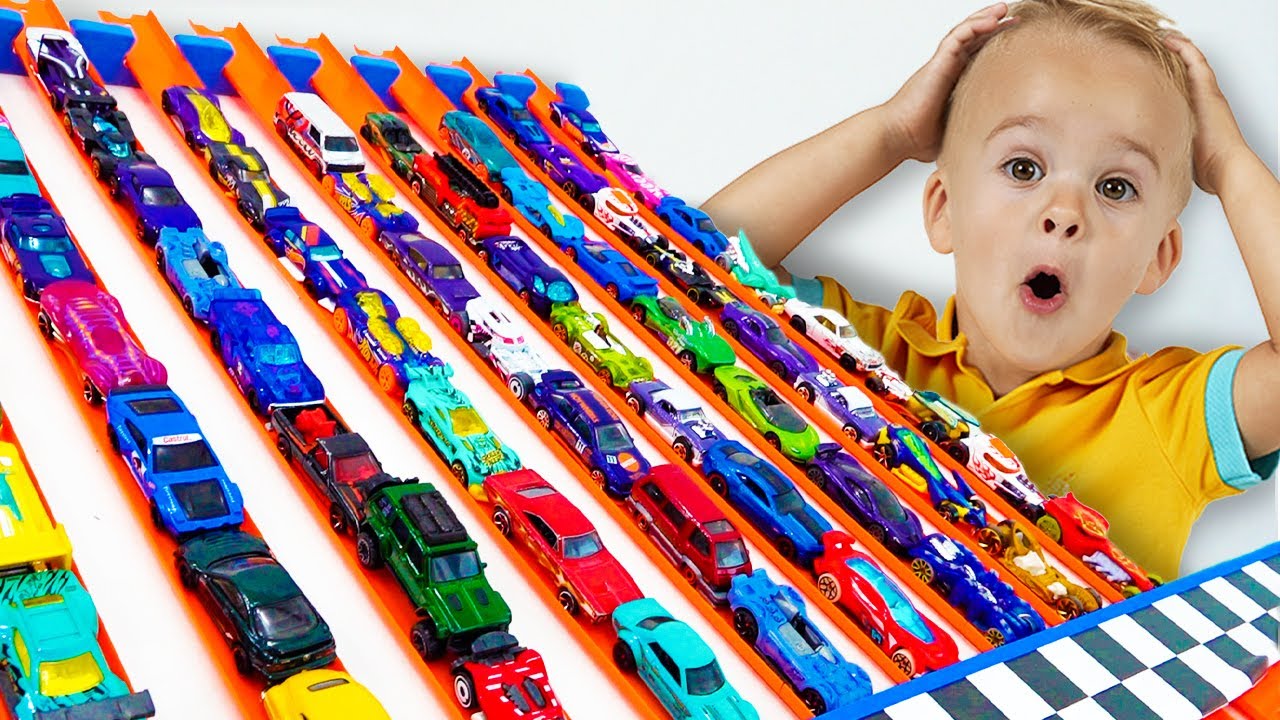 Chris plays with Hot Wheels cars and builds Hot Wheels City 