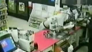 Stupid robber wears socks on his hands
An armed robber tries to hide his identity by putting a newspaper across his face and socks on his hands. Stupid robber wears socks on his hands