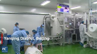 Beijing launches high-speed face mask production line