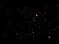 Red Confetti Falling Against Black Background celebration
