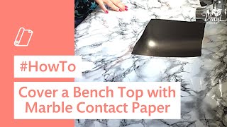 Full instruction video on how to cover a bench top with marble sticky back plastic.