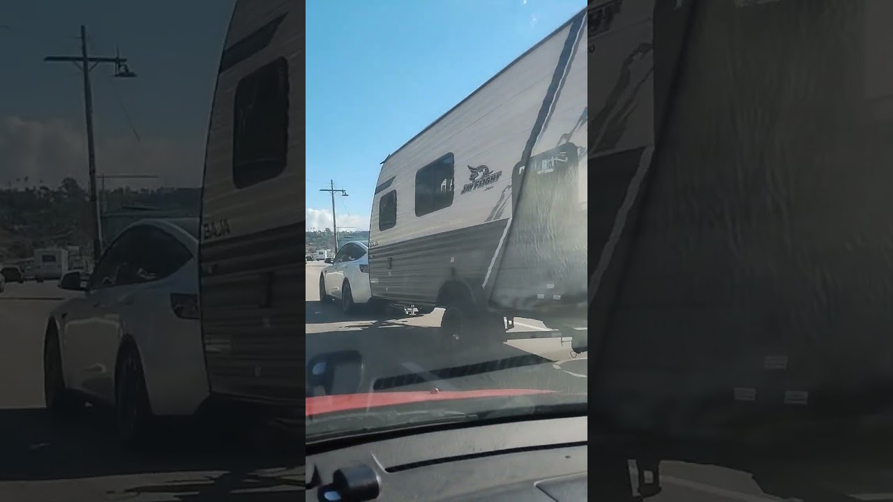 Tesla Model Y Pulling Camper Trailer. 