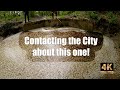 Unclogging the culvert at a small retention pond in 4k