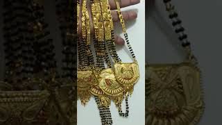 Gold pendent with mangalsut  designess