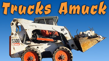 Bobcat S300 Skid Steer Scoops Concrete Into Dump Truck