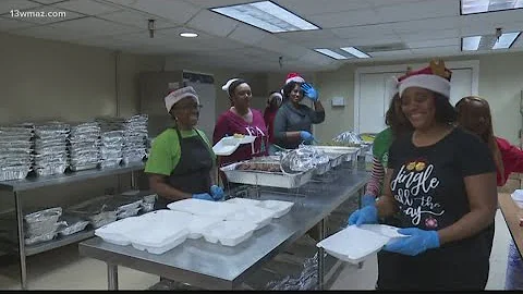Dozens of volunteers share food at 24th Anita Pond...