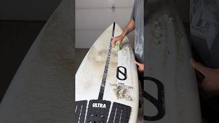 The Satisfying Process Of Taking Wax Off A Surfboard.