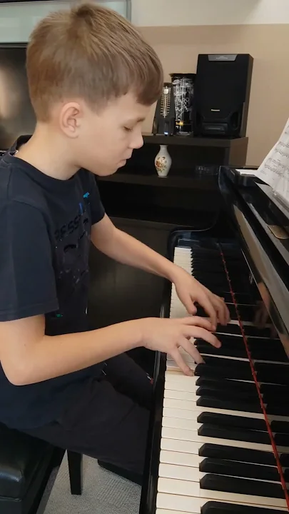 11yr old prodigy casually practices Debussy
