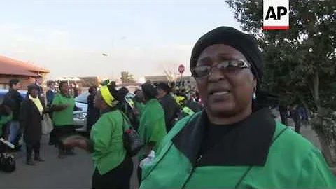 Women from African National Congress sing and pray for Nelson Mandela