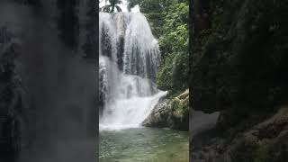 Guy attempts to jump into water from cliff and lands on rock