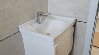 Plumbing Work Wooden &amp; Ceramic  Basin Installed In The Bathroom