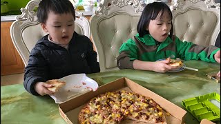 kids are eating delicious pizza