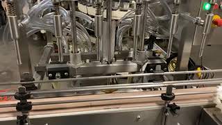 BID ON EQUIPMENT: Item 372871 - DYNAMIC PACKAGING Inline Overflow Bottle Filler with Capper