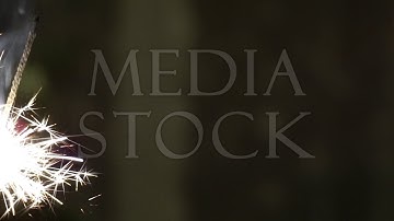 Firework sparkler burning in macro shot