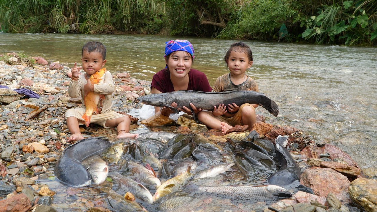 Fishing trapping, harvesting giant river fish to sell - and taking care of two young children.