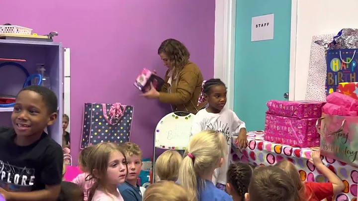 Jasmine opening presents, 6th birthday party