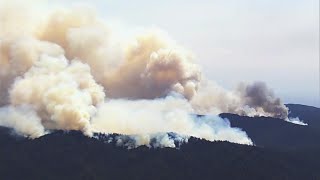 Crews battle large brush fire caused by lightning in Northern California